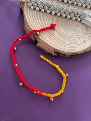 Simple Rakhi With Ghungroo Red/Yellow Criss Cross Thread Rakhi For Raksha Bandhan